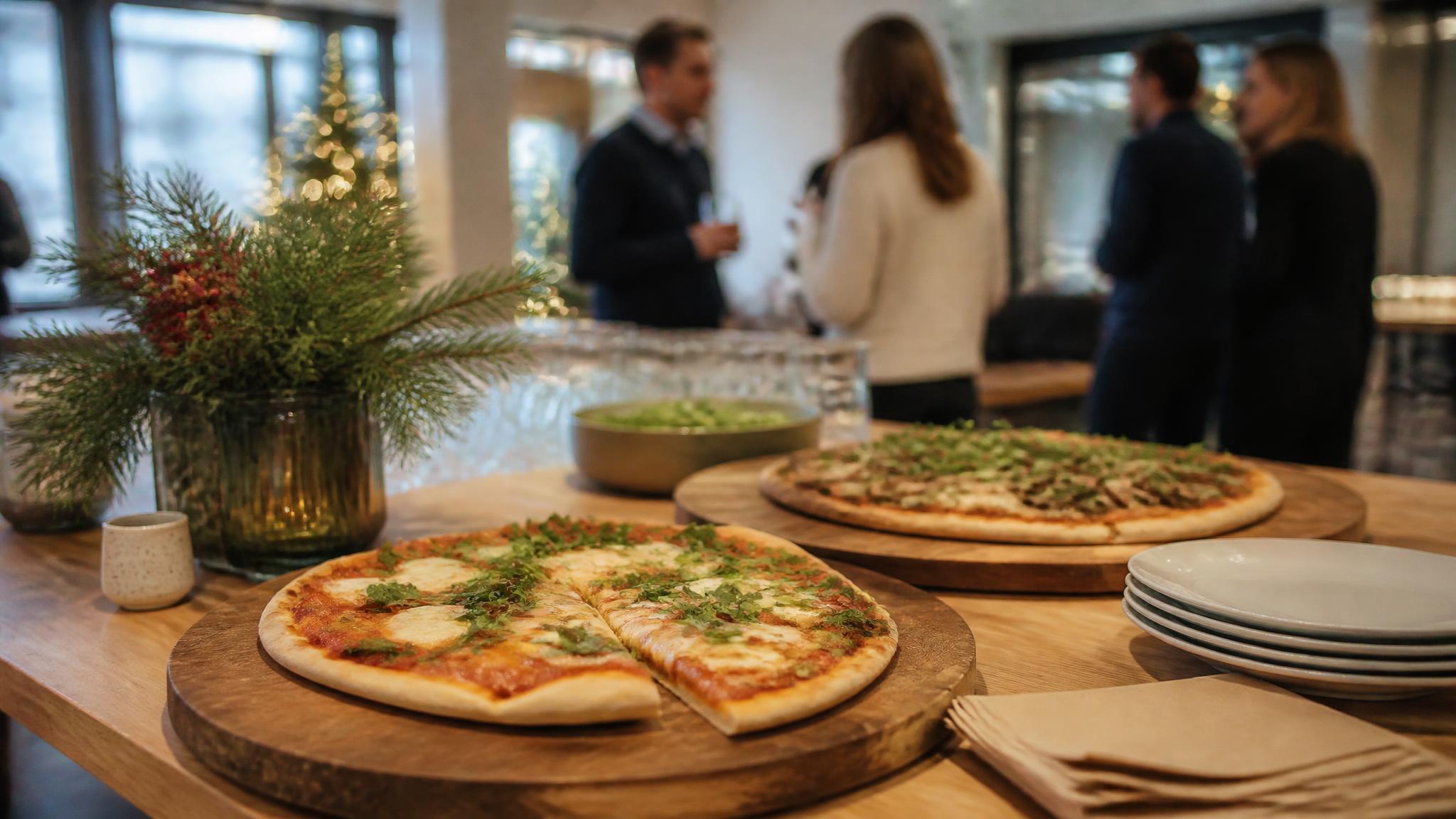 Christmas office catering in E16: staff-only or adult plus-ones? Illustrative pizza catering banner